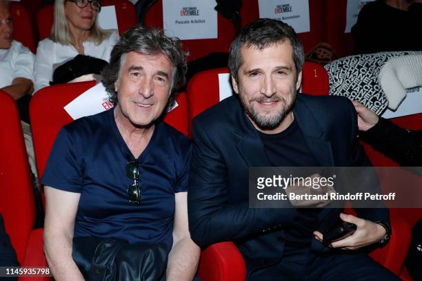 Francois Cluzet and Guillaume Canet attend the "Nous finirons ensemble" Premiere at Cinema Gaumont Capucines on April 29, 2019 in Paris, France.