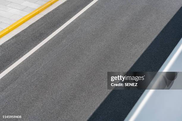 aerial view of empty asphalt road - asphalt von oben stock-fotos und bilder