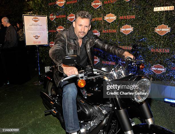 Comedian Harland Williams turns the key on a Harley-Davidson to raise money for Harleys Heroes at the 2010 Maxim Hot 100 Party held at Paramount...