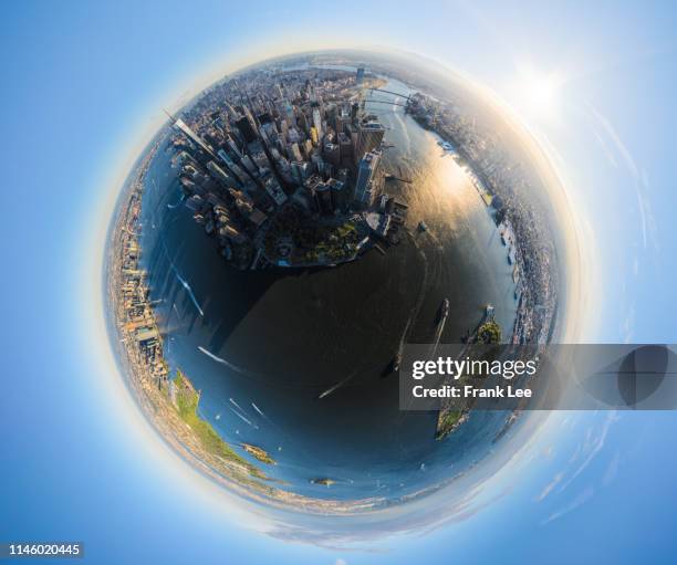 panorama of new york at sunrise in a spherical planet shape - mundo de cristal fotografías e imágenes de stock