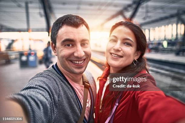 tourists taking selfie at railway station - rotterdam station stock pictures, royalty-free photos & images