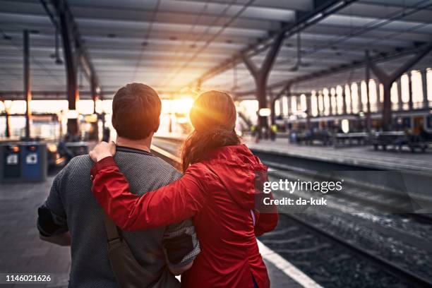 tourists waiting for the train at railway station - rotterdam station stock pictures, royalty-free photos & images