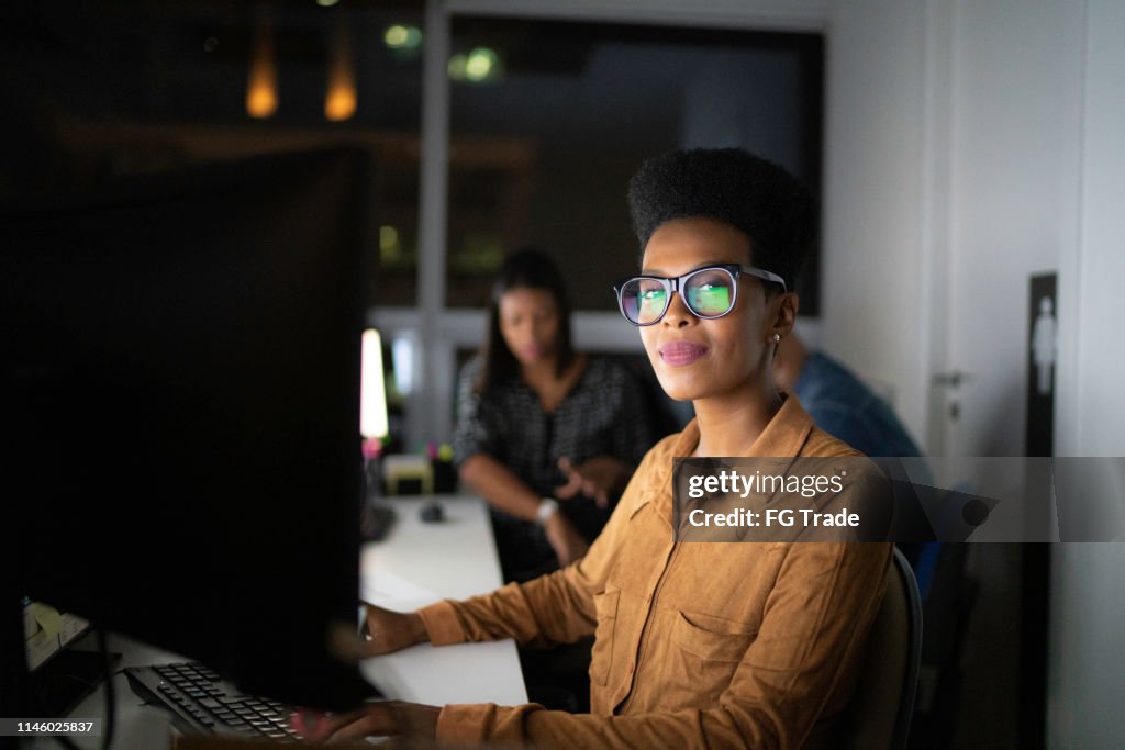 Portrait of businesswoman working late in the office