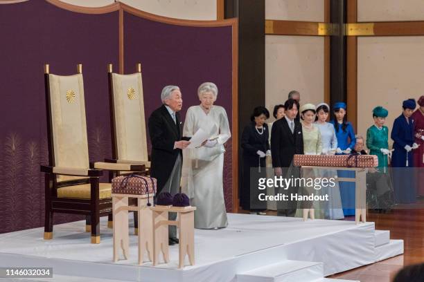 In this handout image provided by Imperial Household Agency, Japanese Emperor Akihito and Empress Michiko attend the abdication ceremony at the...