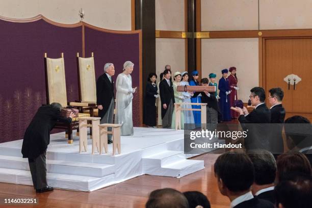 In this handout image provided by Imperial Household Agency, Japanese Emperor Akihito and Empress Michiko attend the abdication ceremony at the...