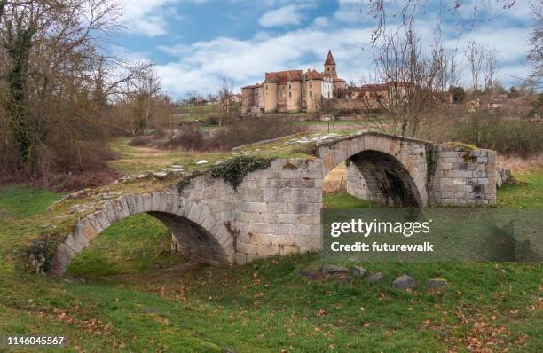 abandoned old stone footbridge that went over a river that's been diverted, near a medieval hill town in the rhone valley, france - rhone stock pictures, royalty-free photos & images