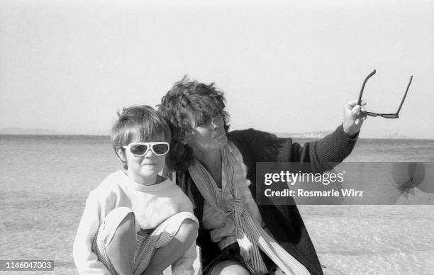 mother and son on beach in sardinia - 1983 stock pictures, royalty-free photos & images