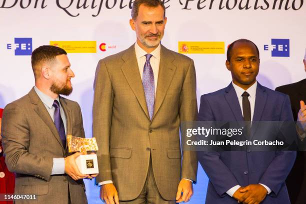 King Felipe delivers his prize to Marcelo Magalhaes and team during the event of delivery of the XXXVI Edition of the International Journalism Awards...