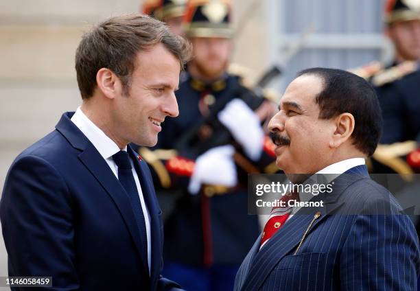 French President Emmanuel Macron welcomes Bahraini King Hamad bin Isa bin Salman Al Khalifa prior to their meeting at the Elysee Presidential Palace...