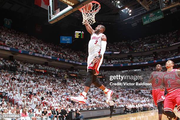 Dwyane Wade of the Miami Heat dunks against the Chicago Bulls during Game Four of the Eastern Conference Finals in the 2011 NBA Playoffs on May 24,...