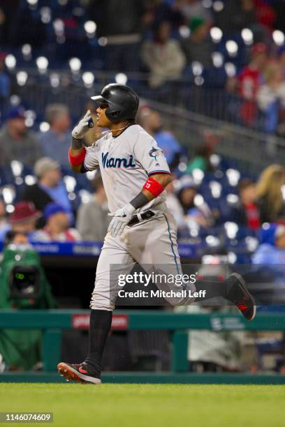 Starlin Castro of the Miami Marlins rounds the bases after hitting a two run home run in the top of the tenth inning against the Philadelphia...