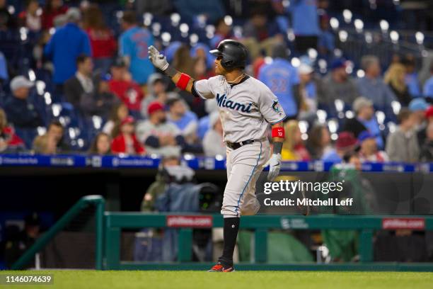 Starlin Castro of the Miami Marlins rounds the bases after hitting a two run home run in the top of the tenth inning against the Philadelphia...