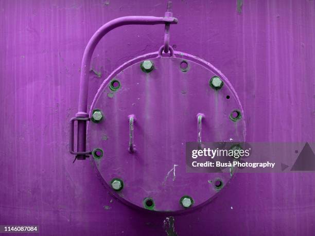 porthole of rusty industrial tank - ironclad stock pictures, royalty-free photos & images