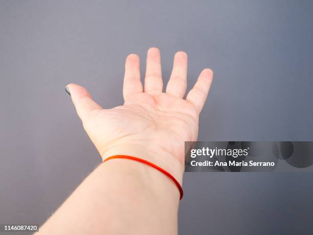 an unrecognizable woman gesturing with his hand - alms stock pictures, royalty-free photos & images