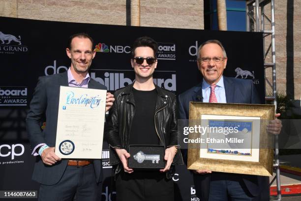 Clark County Commissioner Justin Jones, Brendon Urie of Panic! at the Disco and Clark County Commissioner James B. Gibson pose at MGM Grand Garden...