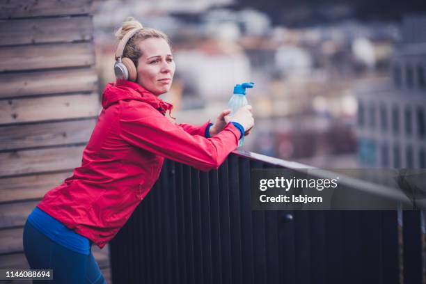 young beautiful female relaxing after training. - norway womens training session stock pictures, royalty-free photos & images