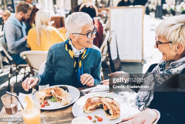 mature women have a lunch - restaurant women friends lunch stock pictures, royalty-free photos & images