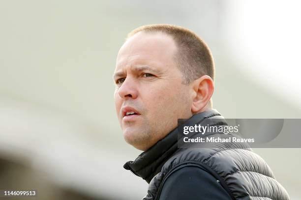 Chad Brown, trainer of Dunbar Road, looks on during morning workouts in preparation for the 145th running of the Kentucky Oaks at Churchill Downs on...