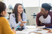 Teen girls debates with peers in class