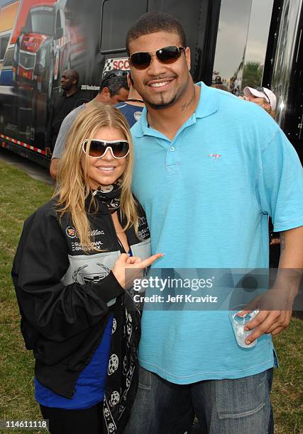 Fergie and Shawne Merriman during The 5th Annual Cadillac Super Bowl Grand Prix at American Airlines Arena in Miami Beach, Florida, United States.