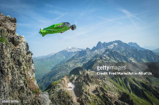 Wingsuit jumper jumping from a cliff in france, Auvergne-rhône-alpes, Chamonix, France on July 4, 2015 in Chamonix, France.