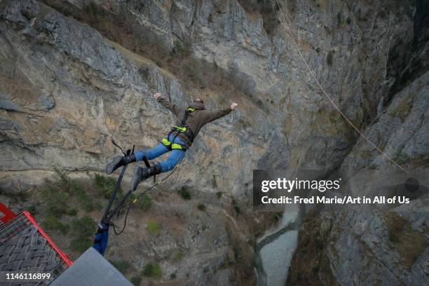 Man doing bungee jumping from niouc bridge, Anniviers, Chandolin, Switzerland on April 1, 2017 in Chandolin, Switzerland.