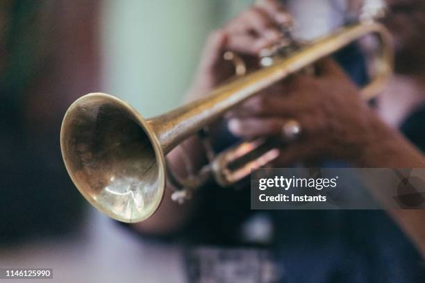 in old havana, close-up of a cuban musician hands while he is playing his trumpet. - havana music stock pictures, royalty-free photos & images