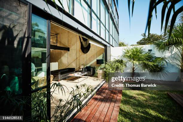 view of living room of home open to outdoor courtyard - building atrium bildbanksfoton och bilder