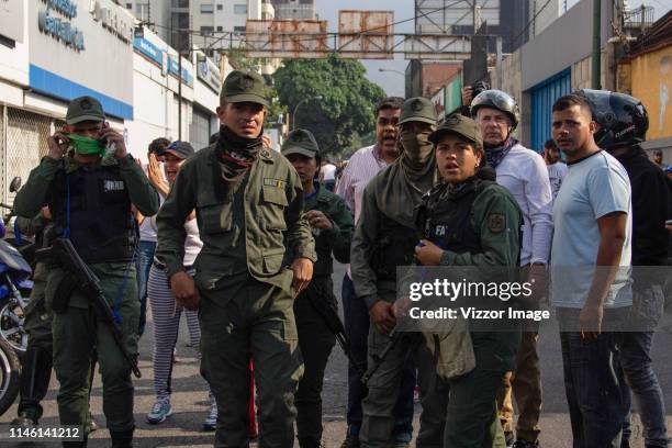 Pro-Guaidó police officers look on around Altamira distribuitor on April 30, 2019 in Caracas, Venezuela. Through a live broadcast via social media,...