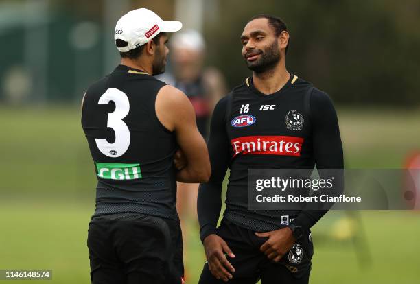 Daniel Wells and Travis Varcoe of the Magpies talk during a Collingwood Magpies AFL training session at The Holden Centre on May 01, 2019 in...