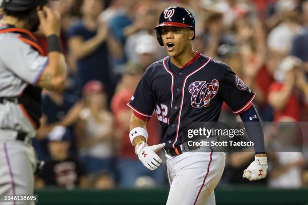 Juan Soto of the Washington Nationals celebrates after hitting the game winning three-run home run against the Miami Marlins during the eighth inning...