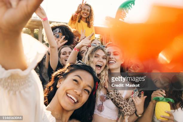 high angle view of cheerful friends enjoying in music event during summer - fan concert stock pictures, royalty-free photos & images