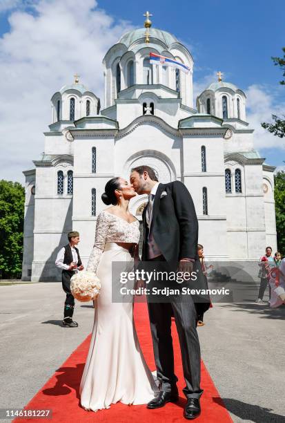 Prince Dushan and Valerie De Muzio kisses after their wedding ceremony at Oplenac church on May 25, 2019 in Topola, Serbia. Prince Dushan...