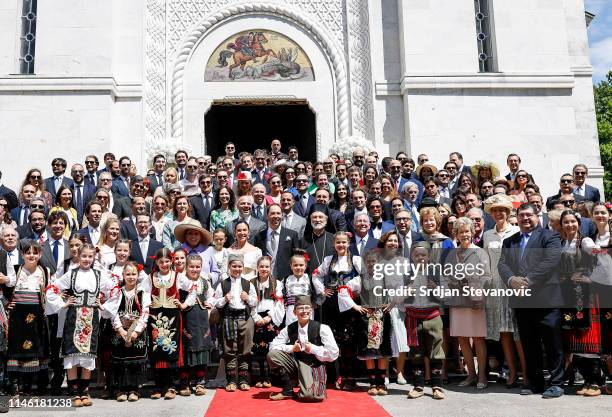 Prince Dushan and Valerie De Muzio pose for a group photo after their wedding ceremony at Oplenac church on May 25, 2019 in Topola, Serbia. Prince...