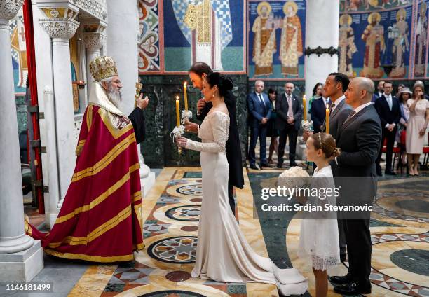 Serbian Orthodox Church Bishop Irinej performs the wedding ceremony of Prince Dushan and his bride Valerie De Muzio at Oplenac church on May 25, 2019...