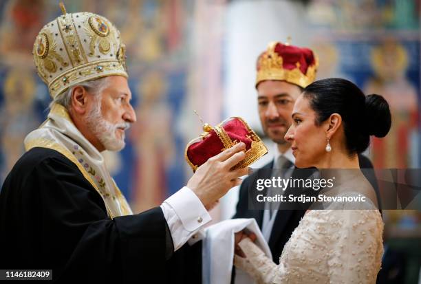 Serbian Orthodox Church Bishop Irinej performs the wedding ceremony of Prince Dushan and his bride Valerie De Muzio at Oplenac church on May 25, 2019...