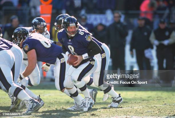 Trent Dilfer of the Baltimore Ravens turns to hand the ball off to a running back against the Denver Broncos during the AFC Wild Card Game December...