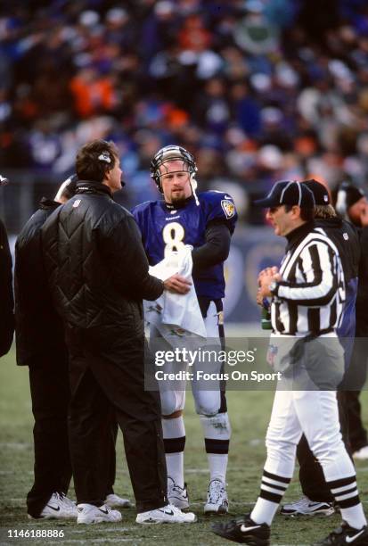 Trent Dilfer of the Baltimore Ravens on the sidelines talking with head coach Brian Billick against the Denver Broncos during the AFC Wild Card Game...