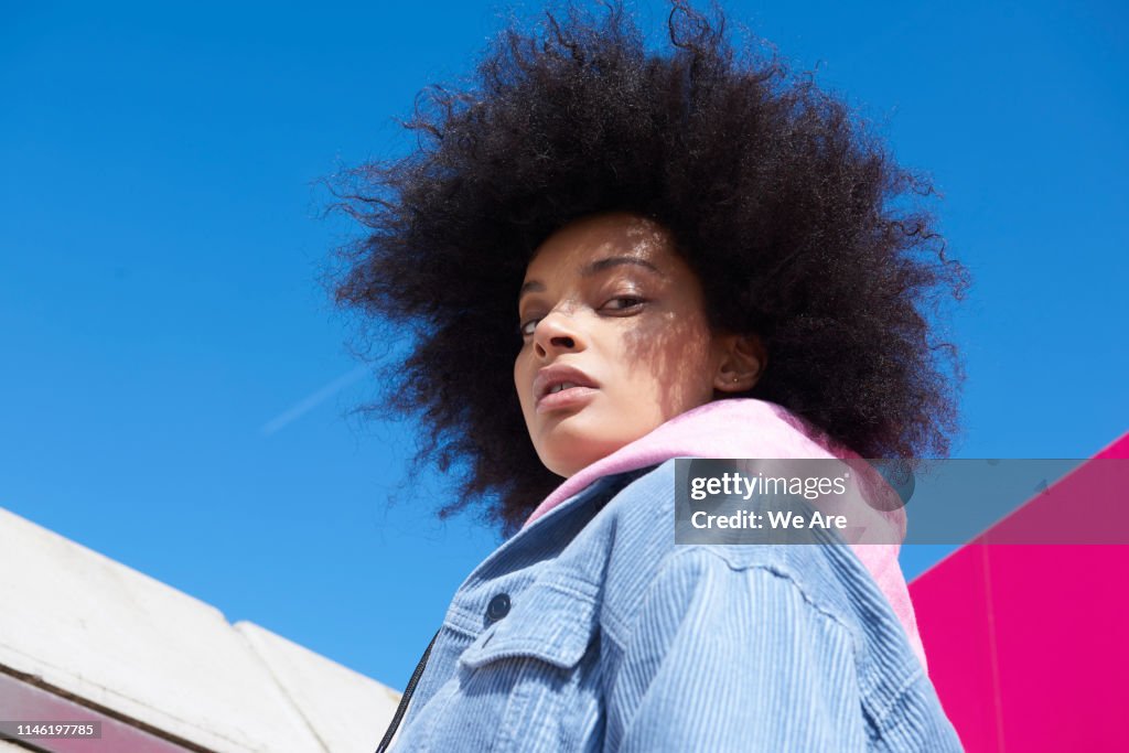 Woman with cool attitude, looking at camera.