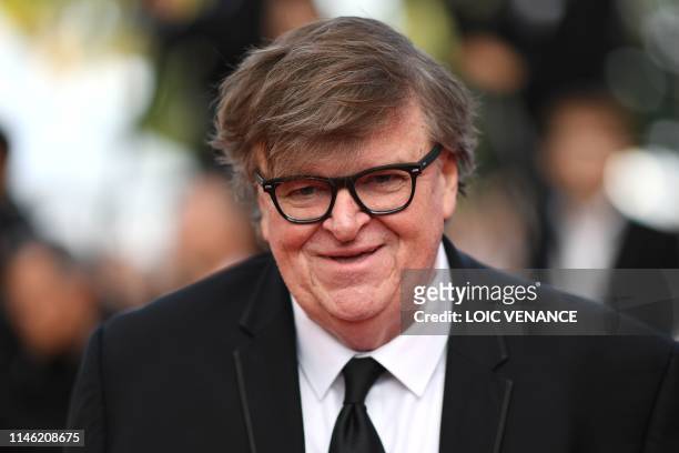 Director Michael Moore smiles as he arrives for the screening of the film "The Specials " at the 72nd edition of the Cannes Film Festival in Cannes,...