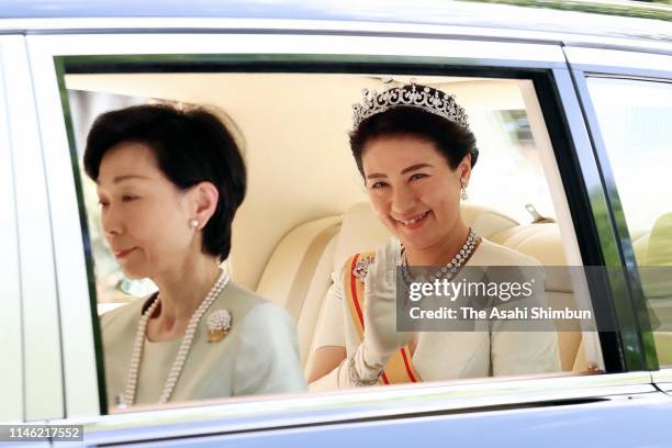 Empress Masako waves to well-wishers on departure for the Imperial Palace prior to the 'Sokui-go-Choken-no-Gi' ceremony that new Emperor Naruhito...