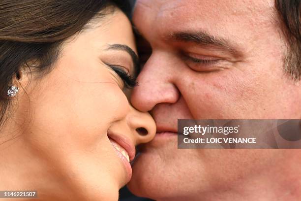 Film director Quentin Tarantino and his wife Israeli singer Daniella Pick pose as they arrive for the screening of the film "The Specials " at the...