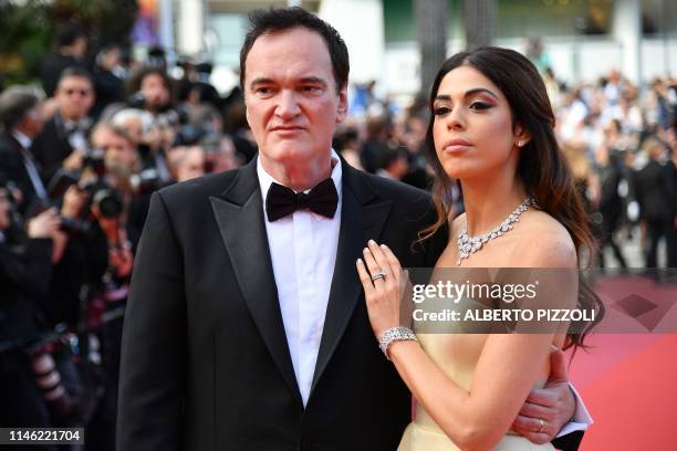 Film director Quentin Tarantino and his wife Israeli singer Daniella Pick pose as they arrive for the screening of the film "The Specials " at the...