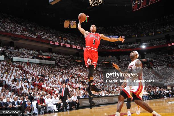 Derrick Rose of the Chicago Bulls dunks against LeBron James of the Miami Heat during Game Four of the Eastern Conference Finals in the 2011 NBA...