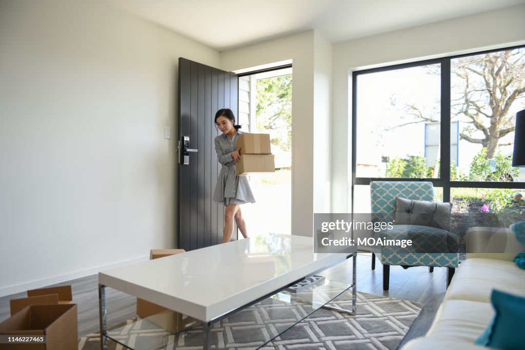 Indoor life portrait of a young Asian woman
