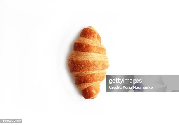 croissant isolated on white background - medias lunas fotografías e imágenes de stock