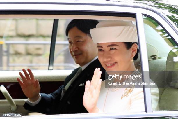 New Emperor Naruhito and Empress Masako wave to well-wishers on departure for the Imperial Palace to meet Emperor Emeritus Akihito and Empress...