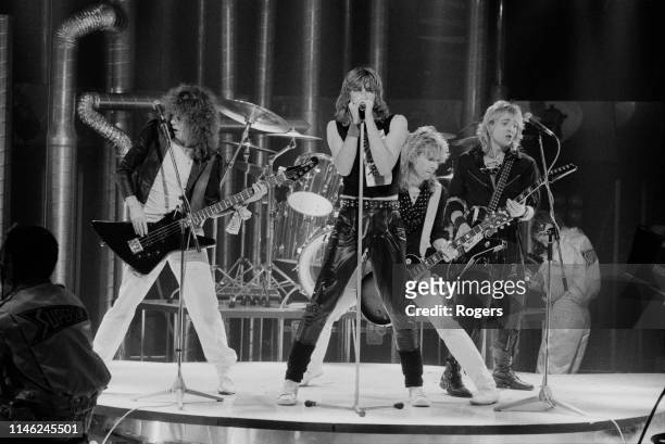 British rock band Def Leppard performing at the Channel 4 Christmas Show, UK, 12th December 1983; they are Joe Elliott, Rick Savage, Rick Allen, Phil...