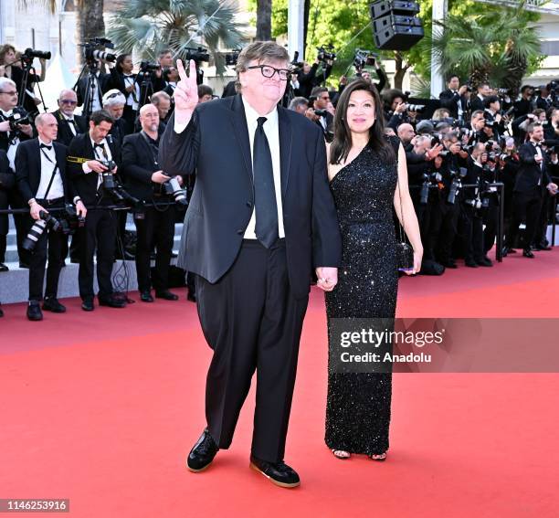 Director Michael Moore and Sonia Low arrive for the Closing Awards Ceremony of the 72nd annual Cannes Film Festival in Cannes, France on May 25, 2019.