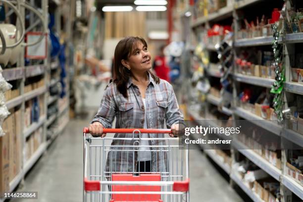 woman shopping at a hardware store - hardware store stock pictures, royalty-free photos & images